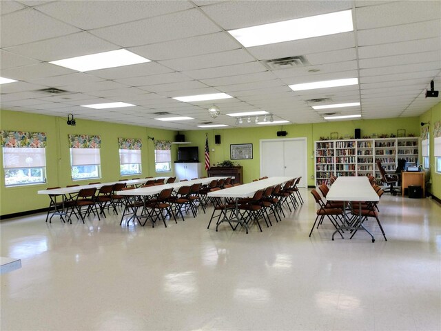 dining area featuring a drop ceiling and visible vents