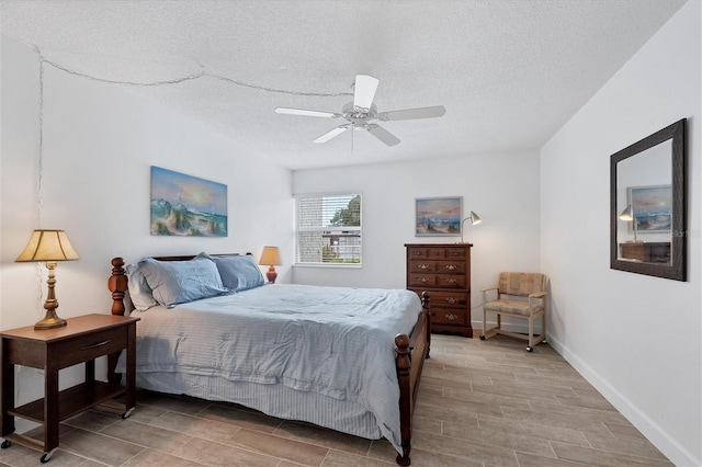 bedroom featuring a textured ceiling and ceiling fan