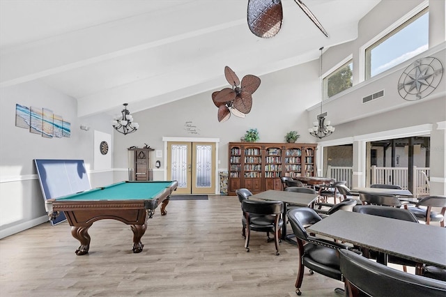 recreation room featuring french doors, light wood-type flooring, beamed ceiling, billiards, and high vaulted ceiling