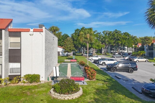 view of community featuring a lawn