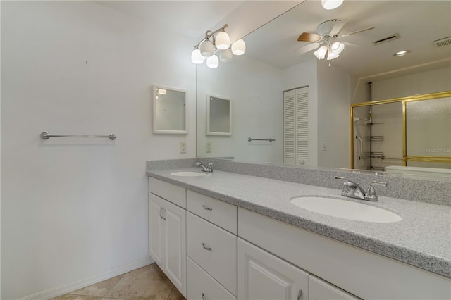 bathroom with ceiling fan, dual bowl vanity, and tile patterned flooring