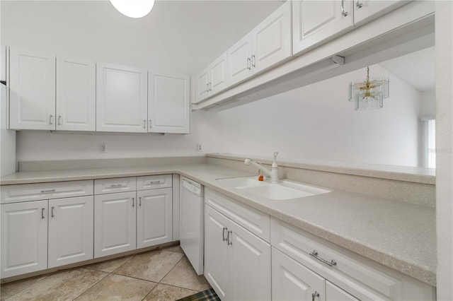 kitchen featuring sink, white cabinetry, dishwasher, and light tile patterned floors