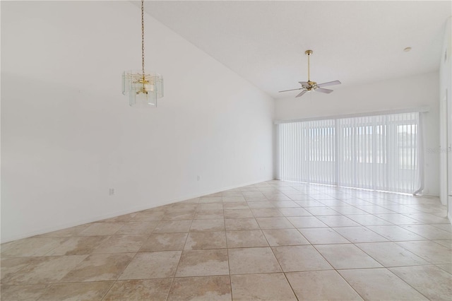 unfurnished room with ceiling fan with notable chandelier, light tile patterned floors, and high vaulted ceiling