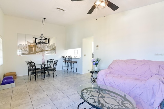 tiled bedroom with ceiling fan