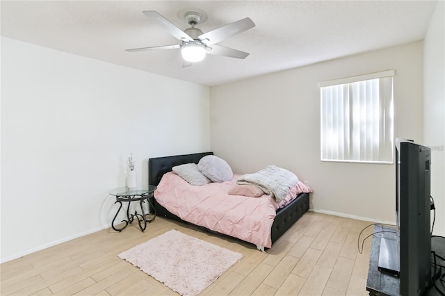 bedroom featuring light hardwood / wood-style flooring and ceiling fan