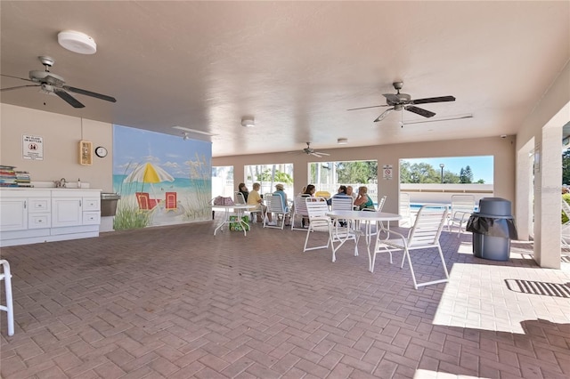 view of patio with sink and ceiling fan