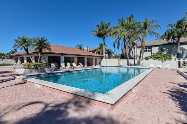 view of swimming pool featuring a patio area