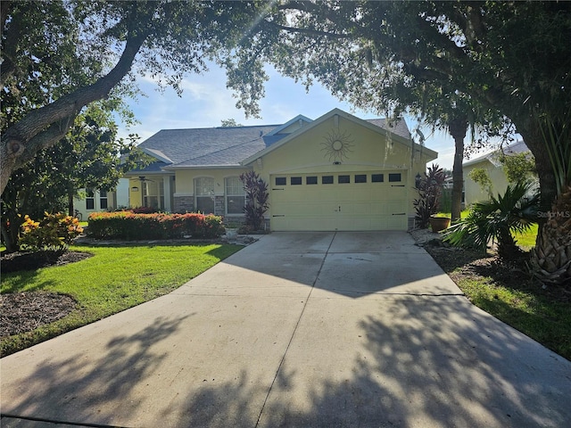 ranch-style home with a garage and a front yard