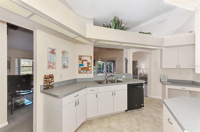 kitchen featuring dishwasher, light tile patterned flooring, white cabinetry, and sink