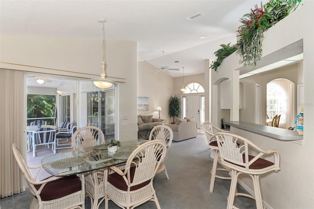 dining room featuring ceiling fan and lofted ceiling