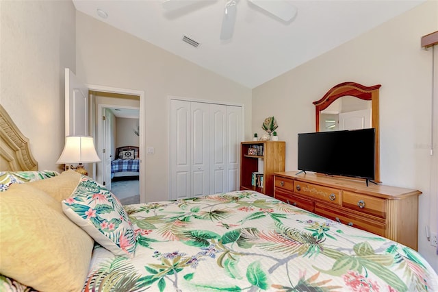 bedroom featuring a closet, ceiling fan, and lofted ceiling