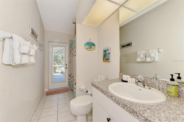 bathroom with tile patterned floors, vanity, and toilet