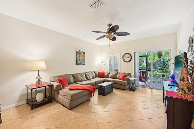 living room with light tile patterned floors and ceiling fan