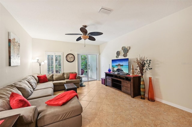 tiled living room with ceiling fan