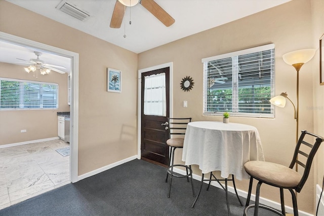839 40th St, Sarasota, FL 34234 - dining area featuring a ceiling fan and baseboards