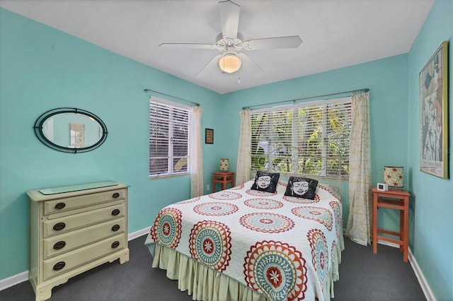839 40th St, Sarasota, FL 34234 - bedroom with dark colored carpet and ceiling fan