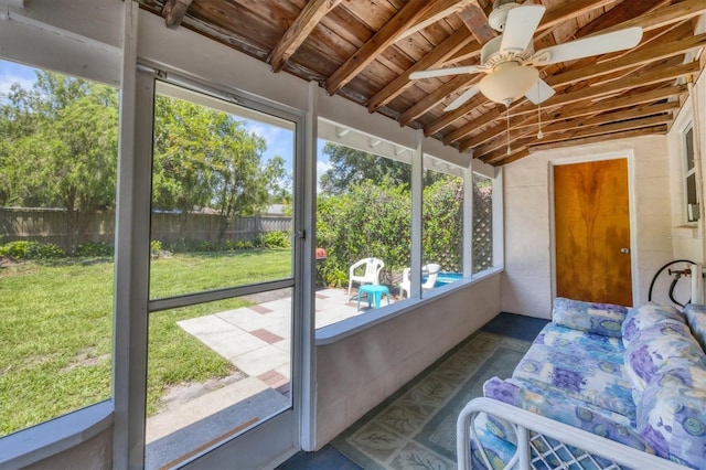 sunroom with wooden ceiling, ceiling fan, and lofted ceiling with beams