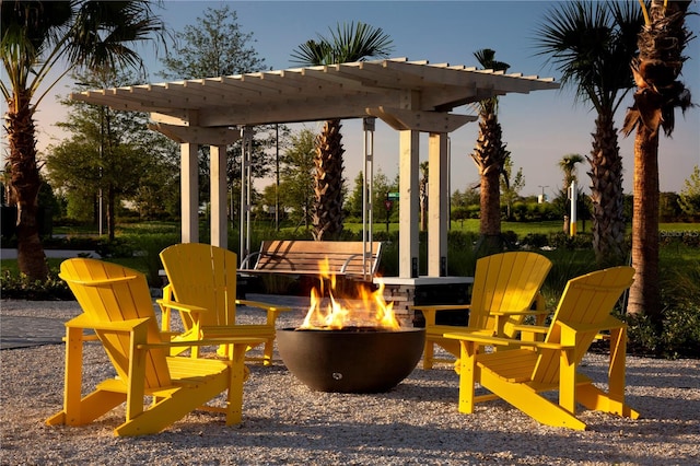 exterior space featuring a pergola and a fire pit