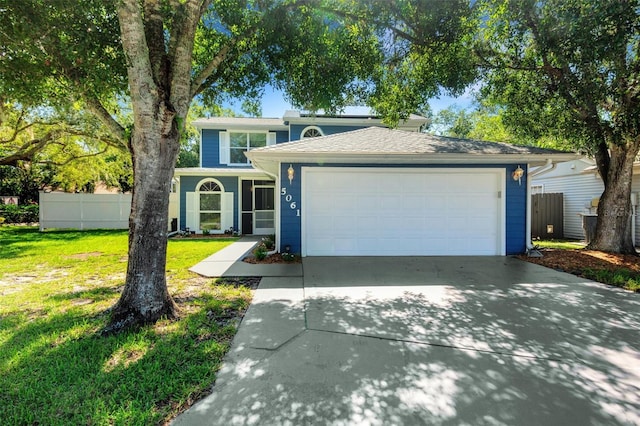 view of front facade featuring a garage and a front yard