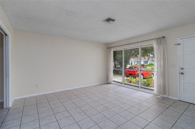 empty room featuring a textured ceiling