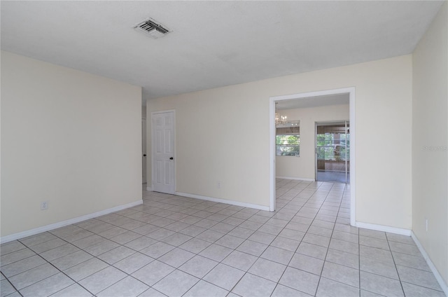 empty room with light tile patterned floors