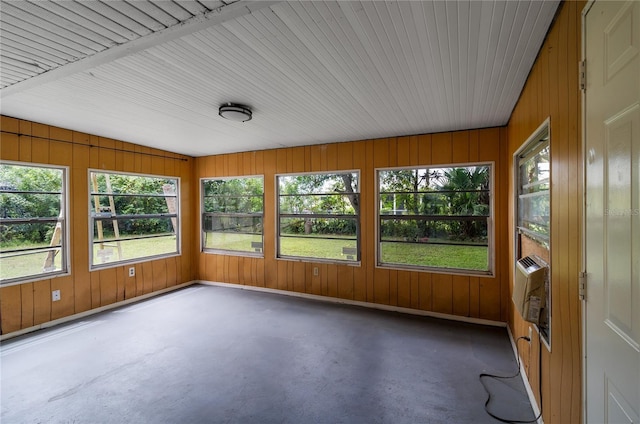 unfurnished sunroom with heating unit