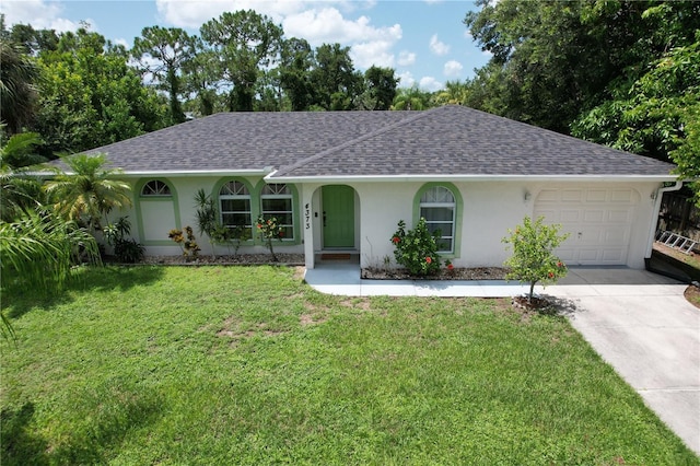 ranch-style home with a garage and a front lawn