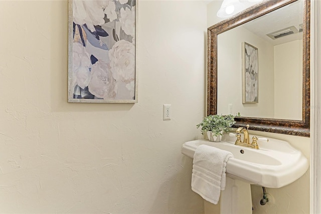 bathroom featuring a sink and visible vents