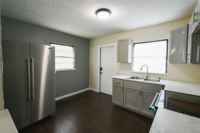 kitchen featuring gray cabinets, dark hardwood / wood-style flooring, sink, and high end fridge