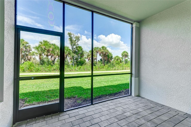 unfurnished sunroom with plenty of natural light