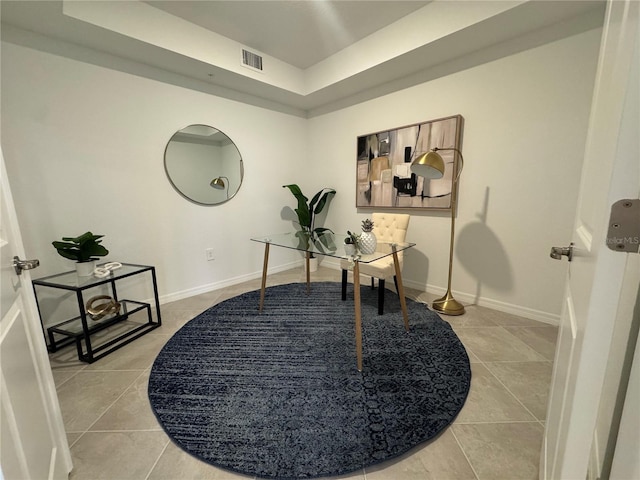 17445 Opal Sand Dr Unit 104, Venice, FL 34293 - office area featuring tile patterned floors, a tray ceiling, and baseboards