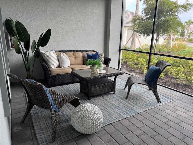 17445 Opal Sand Dr Unit 104, Venice, FL 34293 - sunroom with outdoor lounge area