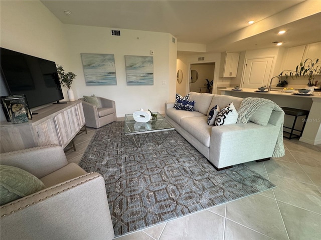 17445 Opal Sand Dr Unit 104, Venice, FL 34293 - living room with tile patterned floors, baseboards, and recessed lighting