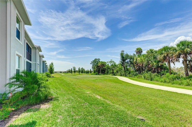 17445 Opal Sand Dr Unit 104, Venice, FL 34293 - view of grassy yard with golf course view and view of wooded area