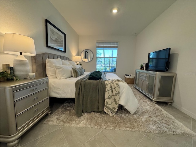 17445 Opal Sand Dr Unit 104, Venice, FL 34293 - bedroom with tile patterned floors and baseboards