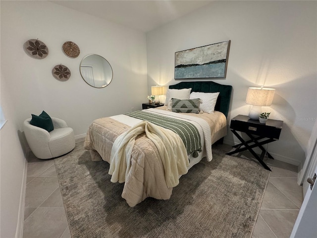 17445 Opal Sand Dr Unit 104, Venice, FL 34293 - tiled bedroom featuring baseboards