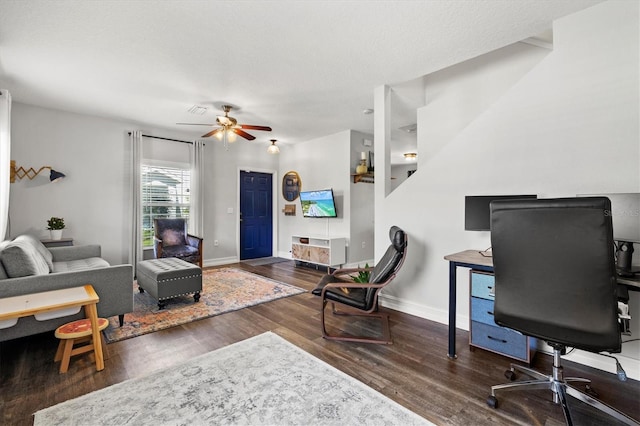 interior space featuring a textured ceiling, hardwood / wood-style floors, and ceiling fan