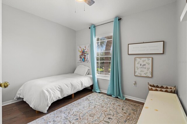 bedroom featuring dark wood-type flooring and ceiling fan