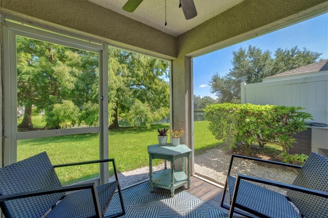 sunroom / solarium with ceiling fan and a wealth of natural light