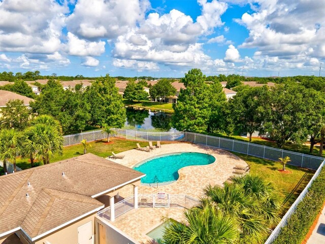 view of pool with a patio and a water view