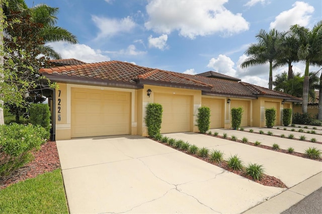 mediterranean / spanish house featuring a garage