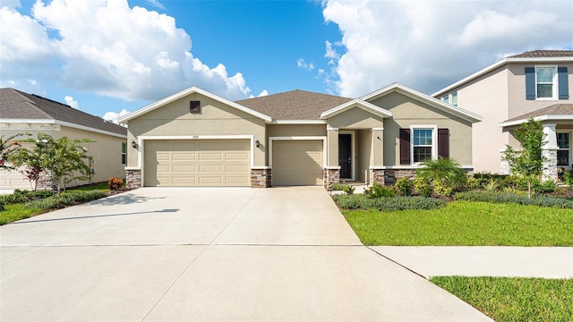 view of front of home featuring a front lawn and a garage