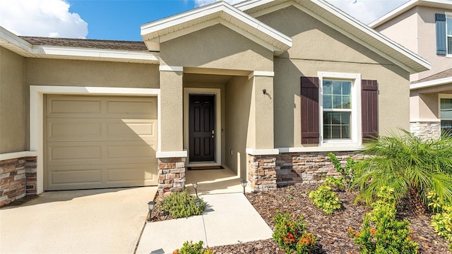 doorway to property featuring a garage