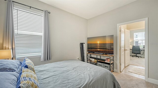 bedroom with light carpet