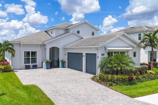 view of front facade with a garage and a front yard