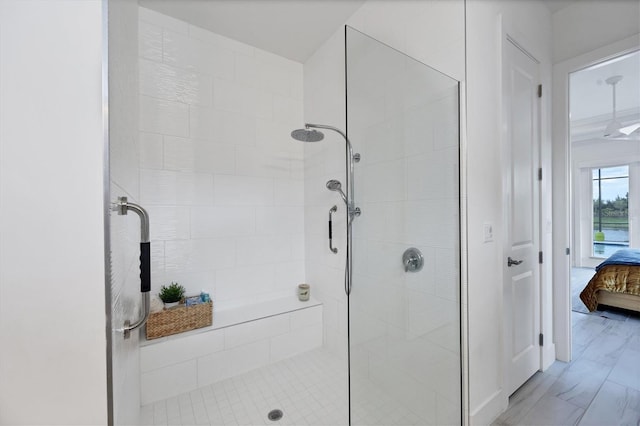 bathroom featuring a shower with shower door