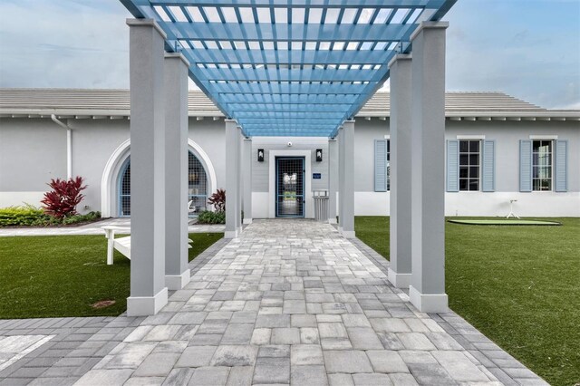 exterior space with a yard and a pergola