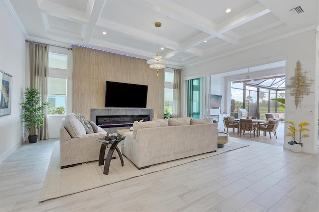 living room featuring coffered ceiling, beamed ceiling, a large fireplace, crown molding, and light hardwood / wood-style flooring