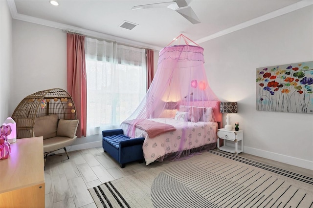 bedroom featuring multiple windows, ceiling fan, and ornamental molding