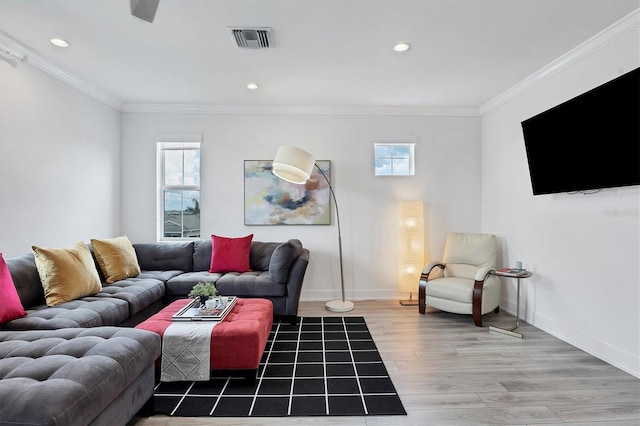 living room featuring ornamental molding and wood-type flooring